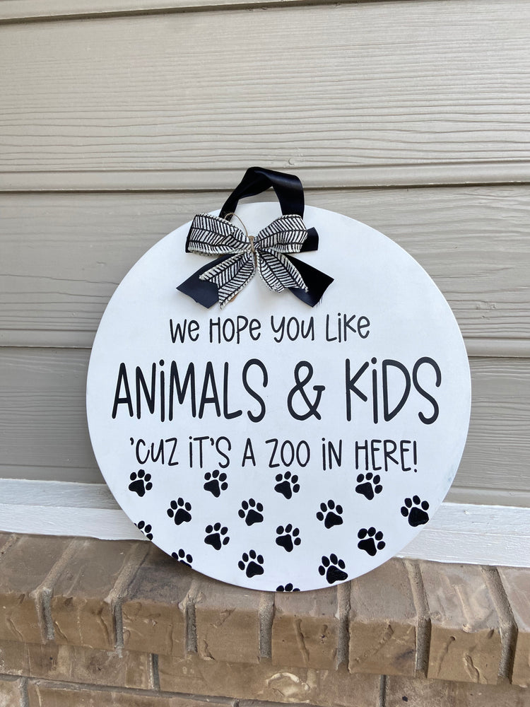 We hope you like animals and kids, ‘cuz it’s a zoo in here! - Door Round