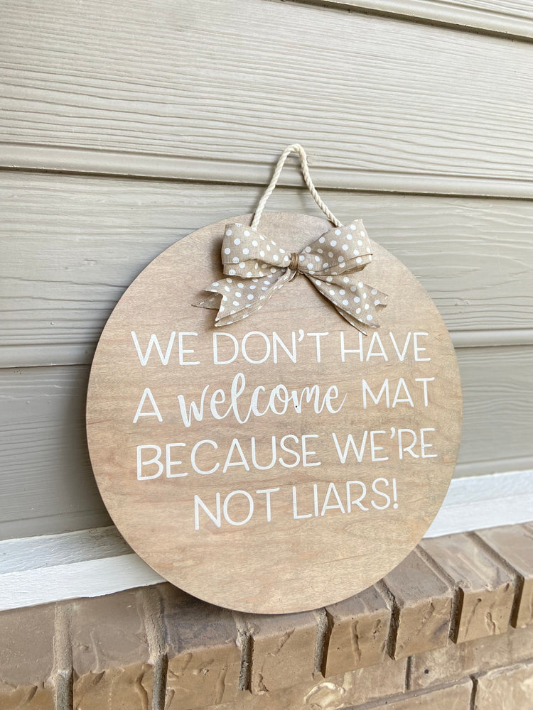 We don’t have a welcome mat, because we’re not liars - Door Round
